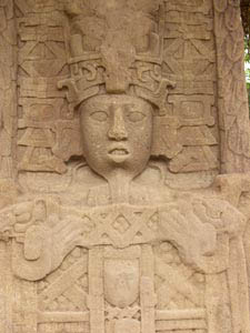 Chaah Bitun holding a double headed serpent bar, Stela C